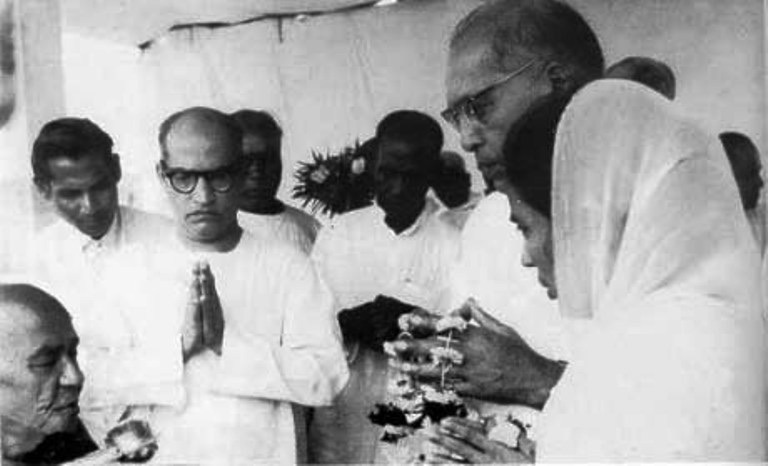 Ambedkar (second from right) accepting Dhamma Deeksha (initiation into Buddhism) from Mahasthavir Chandramani, with Savita Ambedkar (first from right), Wali Sinha and Rewaramji Kawade, on 14 October 1956.