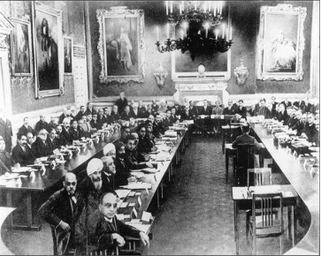 The First Round Table Conference was opened by King George V in London on 12 November 1930. According to the Commons description, Ambedkar, a delegate, is ninth in the left row.