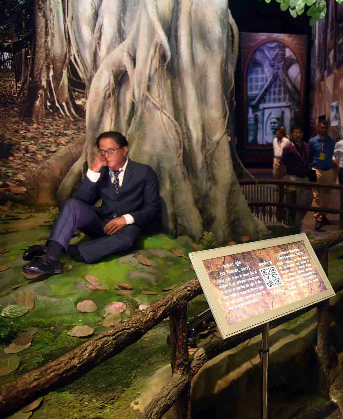 A life-size statue of Ambedkar sitting under a banyan tree, recalling the Sankalp Bhoomi at Vadodara, inside the Dr. Ambedkar National Memorial at 26 Alipur Road, Delhi, where he died. Photographed in 2018.